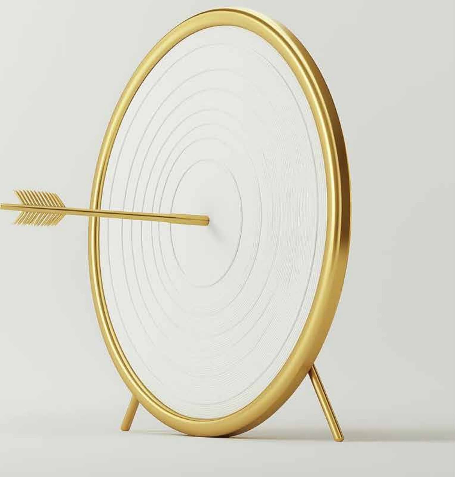 A gold archery target with an arrow through the bullseye — precision, focus and hitting the mark